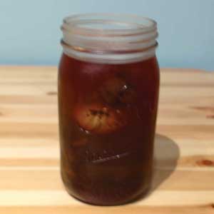coffee dyed eggs in jar with coffee dye solution for refrigerator rest