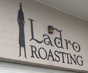 Seattle coffee roaster, Ladro Roasting has its logo over the roastery loading dock